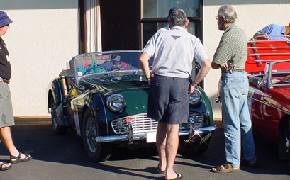 Admiring cars in the morning sun